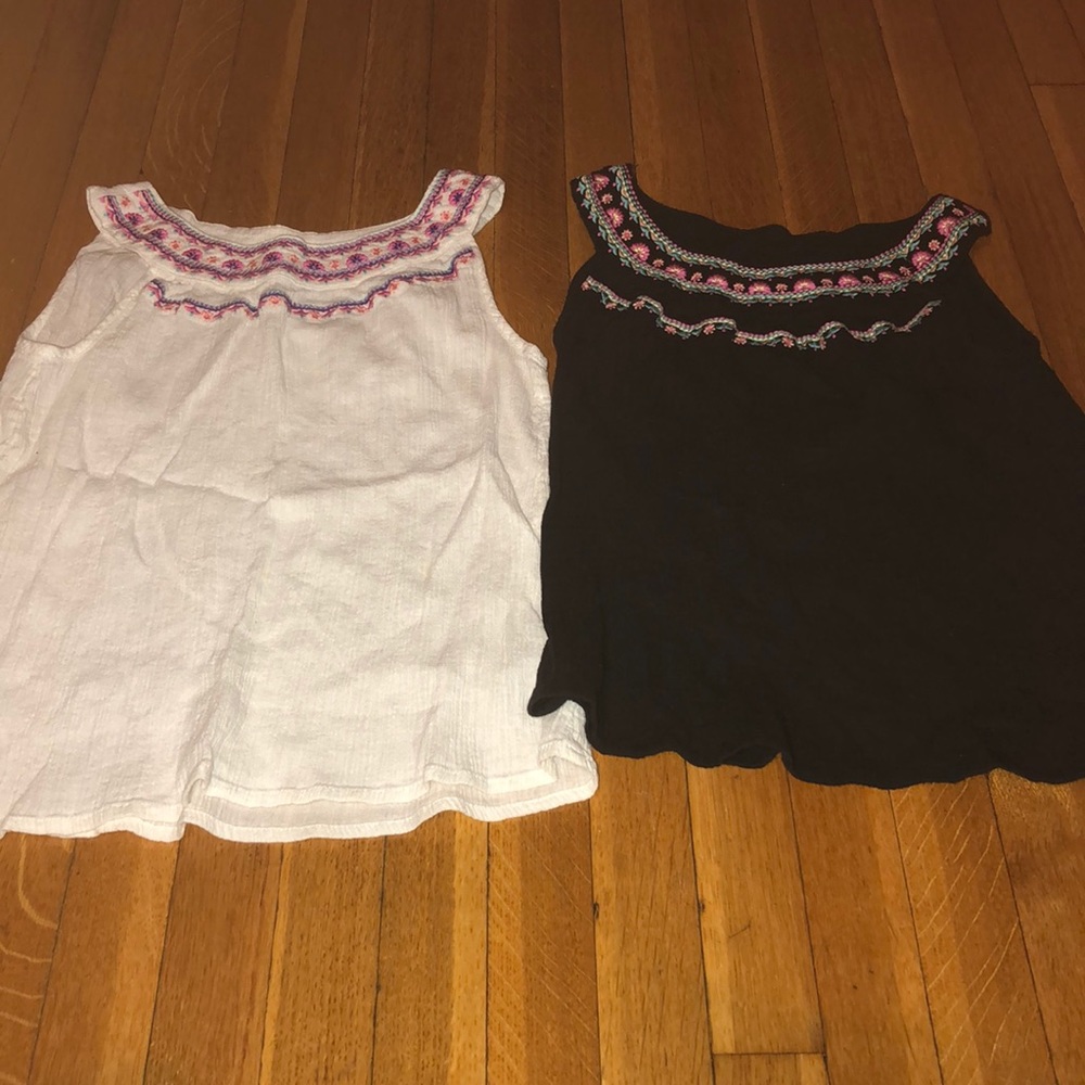 A white and black top with a flower design